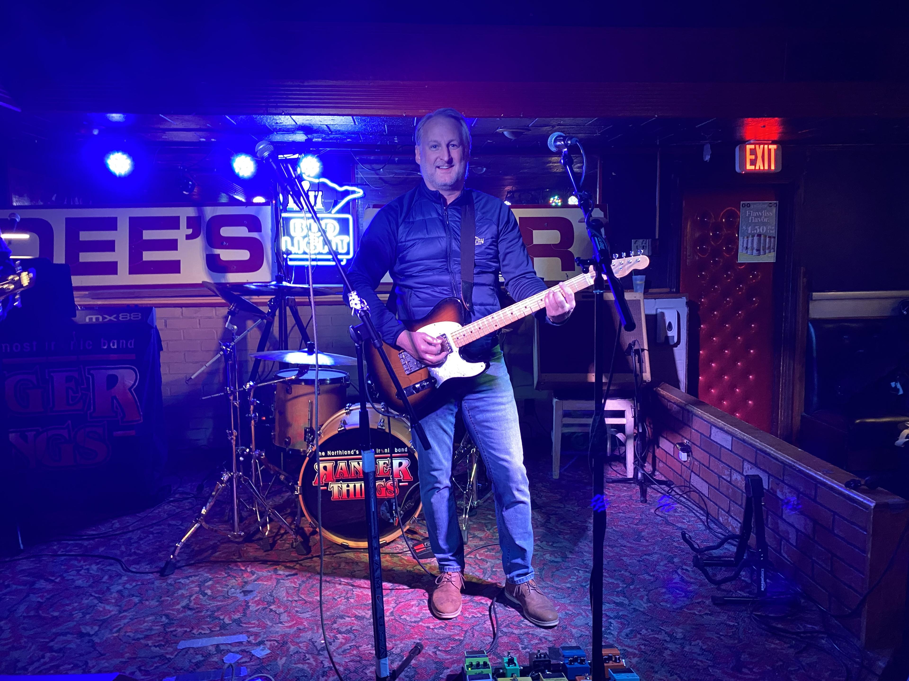 Steve, guitarist of Ranger Things, preparing before a gig